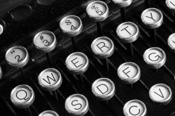 Antique Typewriter Close-up: Close-up of an antique qwerty-format typewriter converted in black & white for a more vintage look.