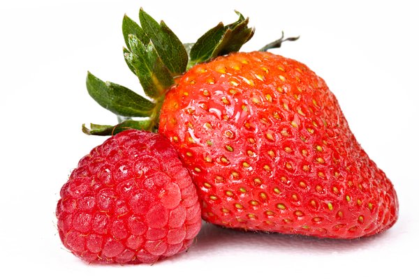 Berry Mix: Close-up of a strawberry and raspberry isolated on a white background.