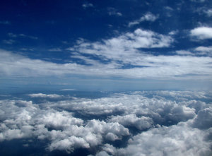 above and below2: clouds seen through plane window during flight