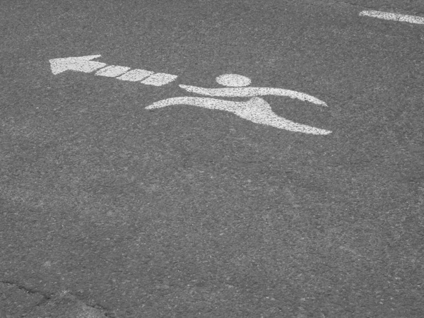 Joggers this way: Peculiar signage painted on a jogging track. Picture taken at República de los Niños public park, Gonnet, La Plata, Argentina.