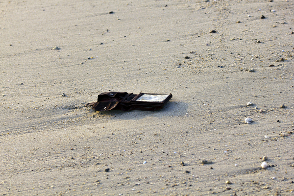 Without at the Beach: Someone lost all at the beach.