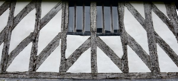 Tudor beams: Beautiful pattern of oak beams in Tudor building in Suffolk.