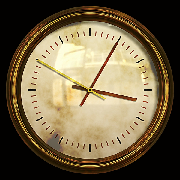 Grunge Clock: A grungy golden clock on a black background.