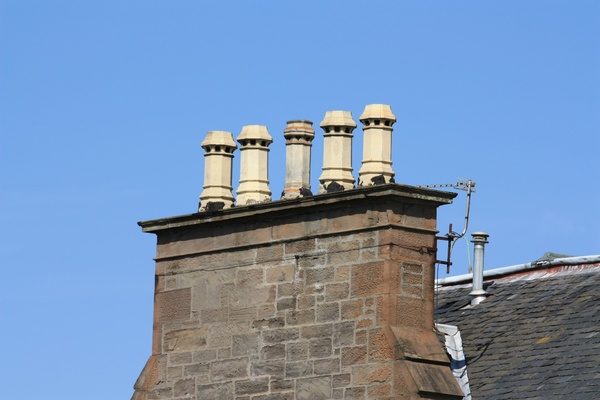 Chimney pots against blue sky