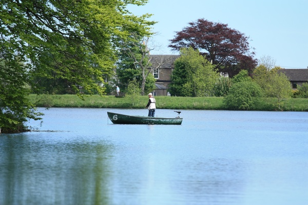 Man on a boat, fishing