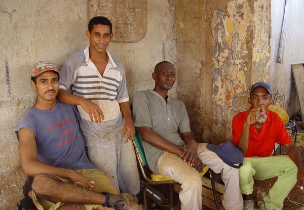 cuban people: A cuban group in a market place in Havana, Cuba