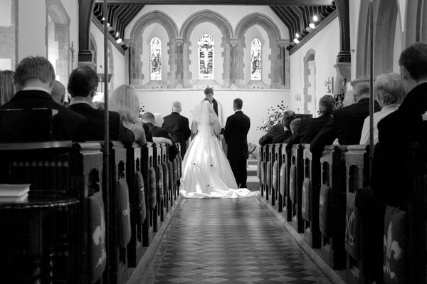Wedding ceremony: Bride, Groom and congregation during wedding ceremony