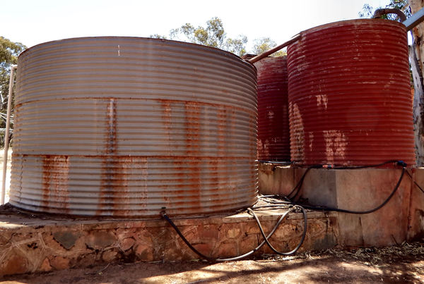 rusty water supply1: large rusty rural corrugated water storage tanks