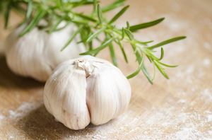 Garlic and rosemary: Essential kitchen herbs. Garlic and rosemary.
