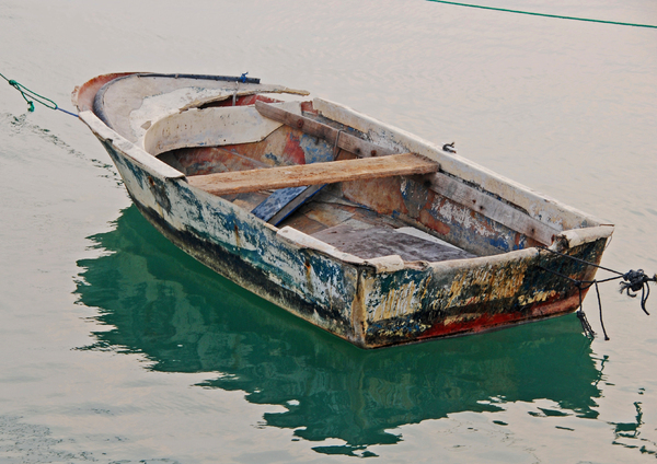 Dilapidated Boat: A weather beaten and dilapidated row boat
