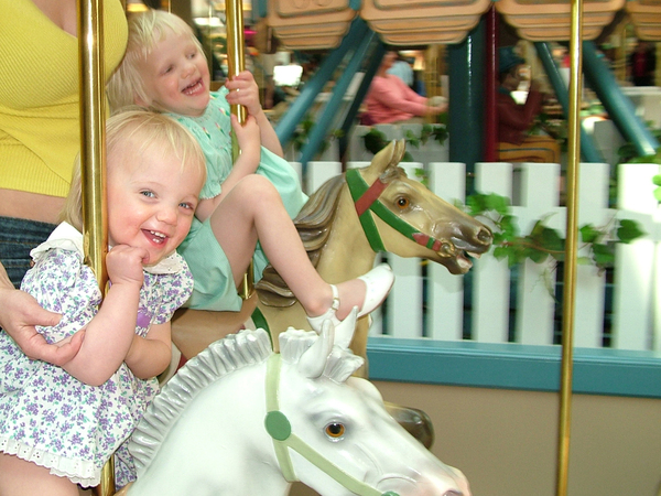 Girls on carousel: Fun on the horsie ride!!!!