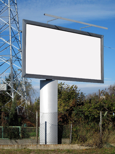 Billboard: A billboard by the road.