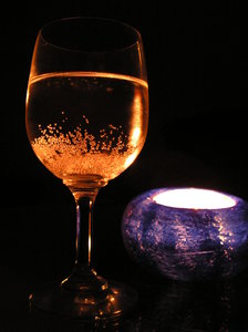 Glass & Candle: Shadow, wine, and silence