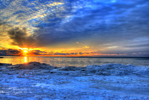 Sunrise over the Ice: Sunrise on the ice of Lake Michigan at Whitefish Dunes State Park, Wisconsin.

If you use this photo please consider crediting http://www.goodfreephotos.com .