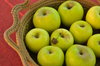 Apples in basket: Close up of green apples in basket.