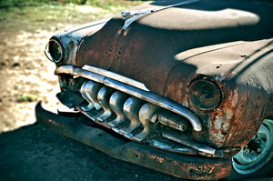Rusty car: Image of an old, rusty, abandoned car 