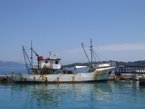 Fishing boat: A fishing boat in the harbor of a Greek island.