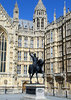 king richard 1: statue of richard the lion heart set against a backdrop of the houses of parliament london
