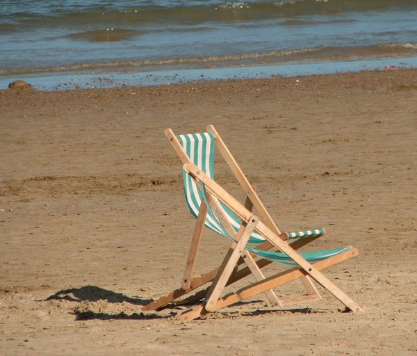 Lonely Beach: a couple of deck chairs left on  the beach