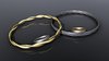 Jewellery: bracelets and rings: An abstract picture of 2 bracelets and 2 rings with multiple colors of gold and special metal on a dark background