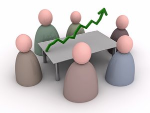 Meeting: Better Results: An abstract picture of persons in a meeting. The subject of the meeting is made visible by a green graph line to achieve better results. 