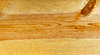 Pine Wood Grain Texture: A section of a pine board with a couple of knots and wood grain texture.