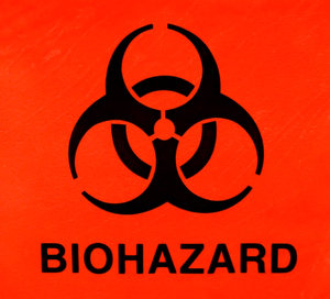 Biological hazard Symbol: The international symbol for biological hazard.
In Unicode, the bio-hazard sign is U+2623 (â�£).

This shot was taken of a sample bag with the symbol and the bag was lit from the back.. It is an international symbol with no copyright assigned to it.