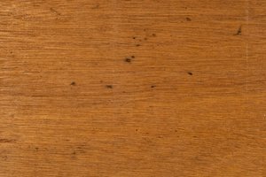 Laminate Wood Texture: A view of the grain pattern from the inside surface of a sliding door from a cheap cabinet. The wood has a mosaic like grain pattern from being peeled off of the log to make the thin laminate.