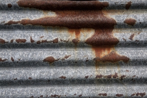Rusty Corrogated Metal: A section of a corrogated metal wall with a natural weathered rust pattern.