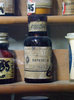 Ye Olde Naphtol Bottle: An old apothecary bottle or flask, on display on a shelf.