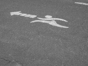 Joggers this way: Peculiar signage painted on a jogging track. Picture taken at República de los Niños public park, Gonnet, La Plata, Argentina.