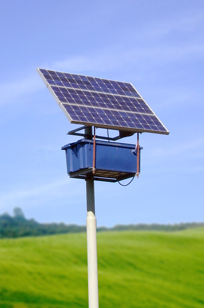 Small solar panel: A small solar cell panel in a field.