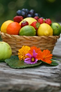 Fruit Basket: Stil life of fresh fruit and flowers.