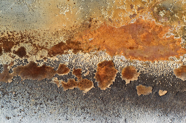 Steel, Paint and Fire: Details of burned paint on the hood (bonnet) of a car.