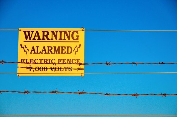 Security: Electric fence warning.