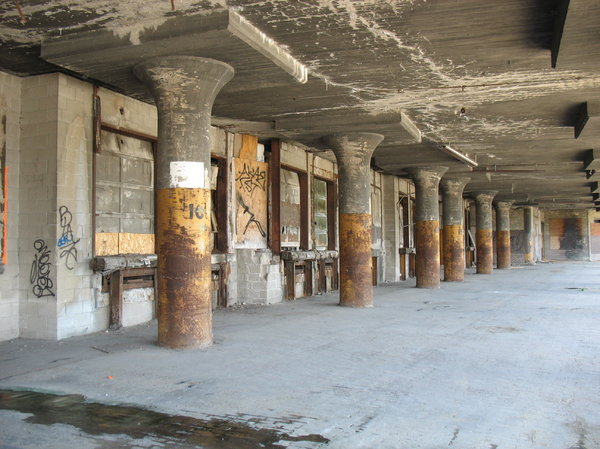 decaying loading dock: a forgotten and decaying loading dock beneath the railroad tracks