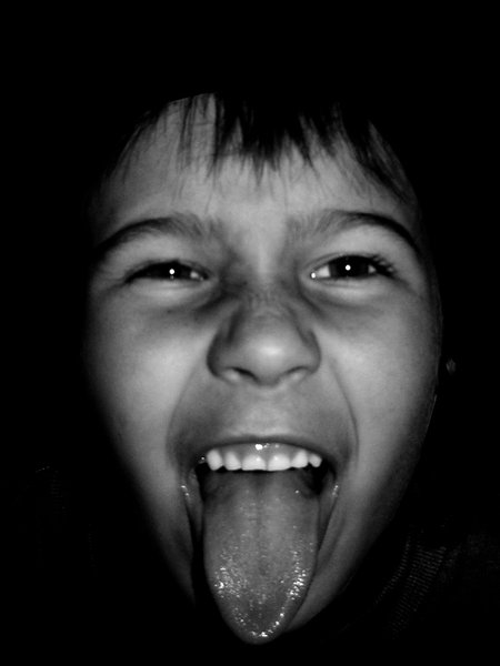 Face: Girl sticking her tongue out with a touch of black and white.