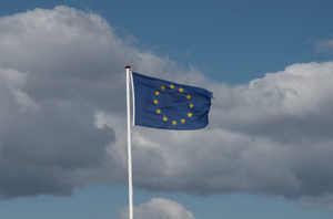 Europe: European Flag in the storm with ragged edge. Perhaps a symbol for Europe today and its challenges.