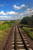 Rural landscape with the rail: Rail under the clouds