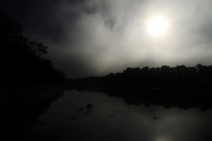 Heart of darkness: Low light photography. A misty river or lake, far away from the urban world