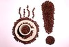 Shouting coffee: Coffee beans in the shape of an exclamation mark and an espresso cup with coffee beans in it