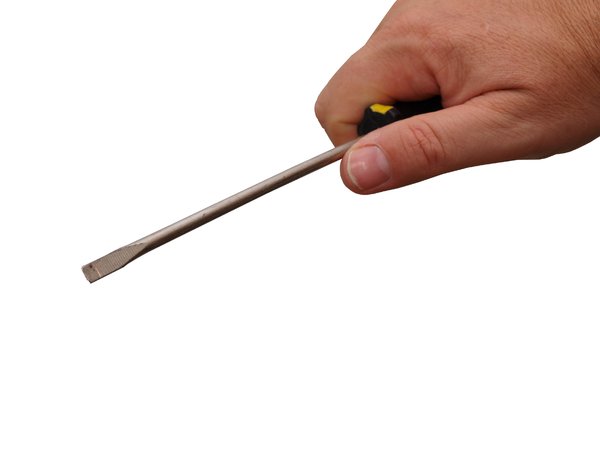 Handheld screwdriver: Hand holding a screwdriver