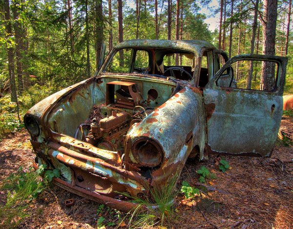 Disintegration - HDR: Old car left in Sweedish forest to disintegrate (in peace). The picture is HDR using five images.
