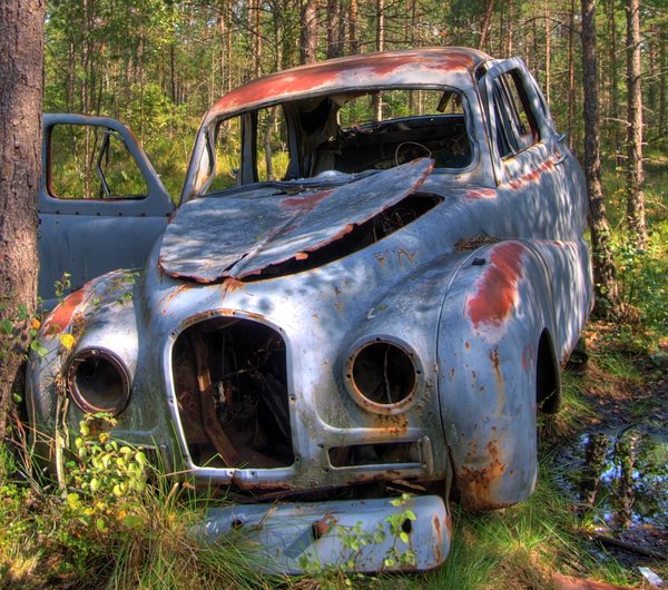 Disintegration - HDR: Old car sitting in a forrest for 50 years. The picture is HDR derived from five individual pictures.
