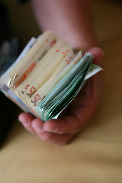 cash in hand: money in wallet and in hand