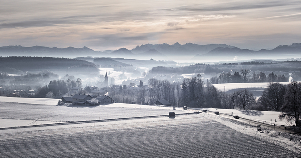 Morning on Winter Landscape: Snowy Landscape with small Village at early Morning, foggy Atmosphere 