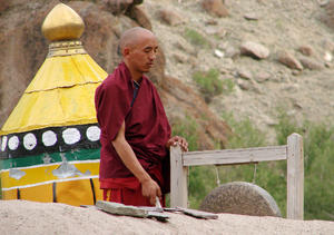 Buddhist Monk Praying: A Buddhist Monk Praying at the Hemis Monastery, Ladakh.