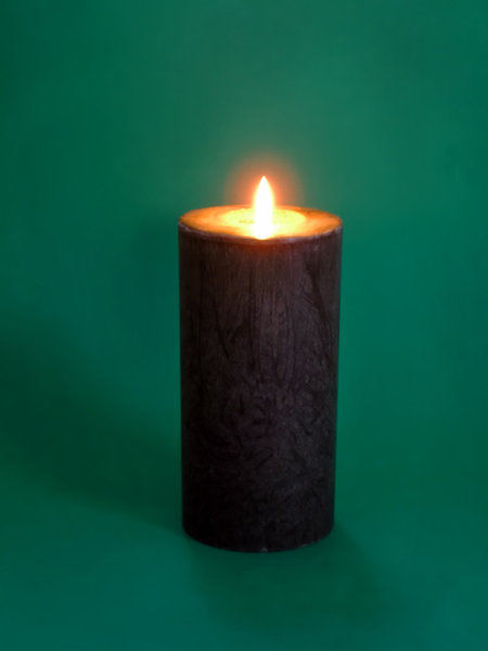 Candle: Lighting candle on the green background