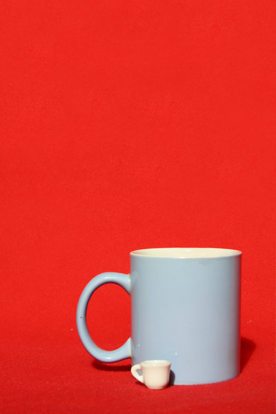 Mugs: Two mugs on the red background