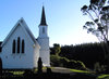 Country church: Anglican Church from colonial days in New Zealand.  Graveyard in front, my family buried behind the church.  Slits in the church for guns as during Maori wars my family and others were holed up inside.